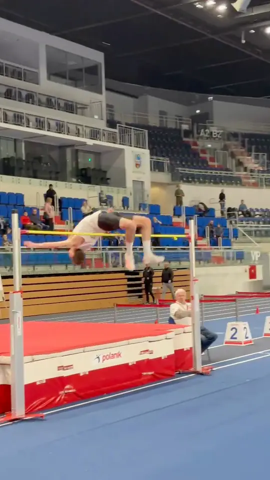 Dominik Zdrajkowski arched over the bar at 2.15 m, Toruń, January 2026